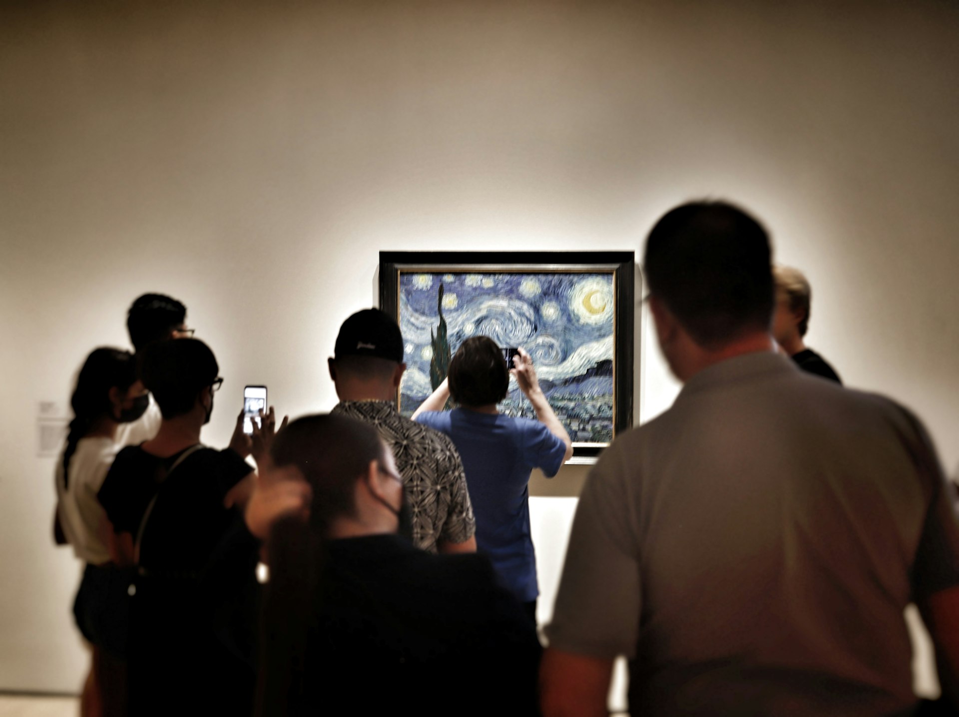 a group of people looking at a screen
